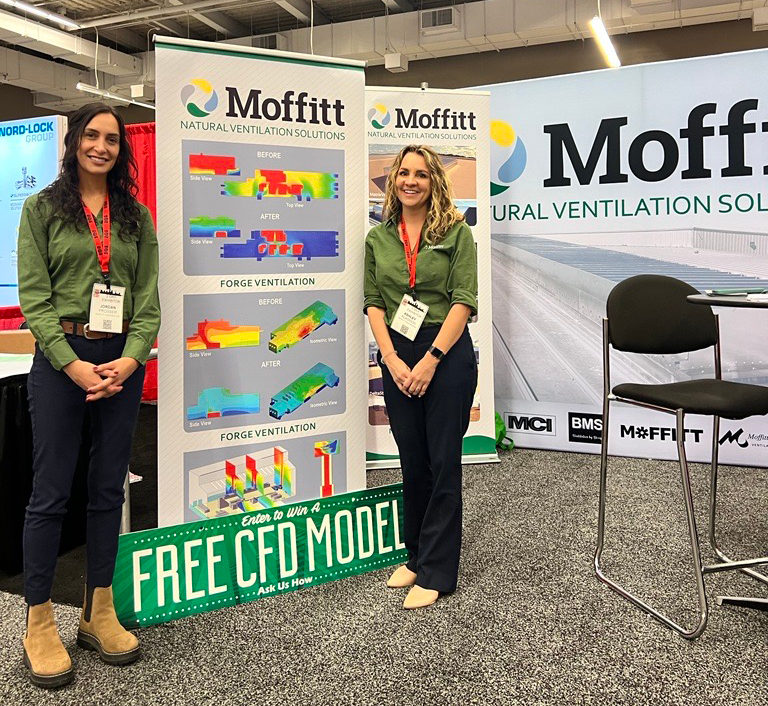 Moffitt sales people at a tradeshow booth.